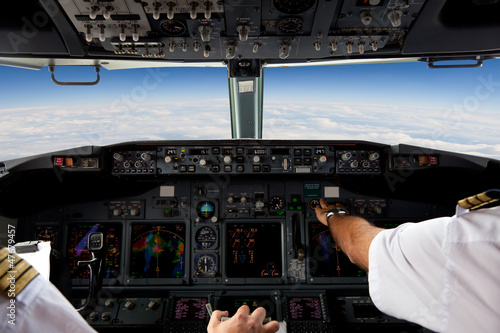 Photo: Pilots Working in an Aeroplane During a Commercial Flight Pilots Working in an Aeroplane During a Commercial Flight