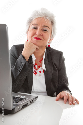 Photo: Ältere Dame hat Freude am Job - isoliert Ältere Dame hat Freude am Job - isoliert