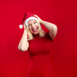 pretty blonde woman wearing a christmas hat having fun