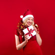 pretty blonde woman wearing a christmas hat having fun