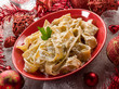 Photo: pasta with ricotta and pine nuts on christmas table pasta with ricotta and pine nuts on christmas table