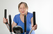 Senior woman on  training bicycle