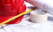 Architectural drawings, helmet, measure and insulating tape