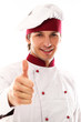 Young and handsome cook showing thumbs up