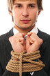 Handsome businessman hands tied with rope