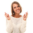 Young and attractive woman crossing fingers
