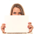 Foto: Young smiling woman holding blank paper Young smiling woman holding blank paper