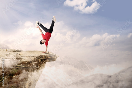 Photo: Acrobatic competition cartwheel on mountain Acrobatic competition cartwheel on mountain