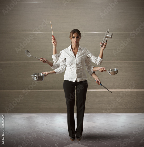 Photo: Multitasking woman in kitchen Multitasking woman in kitchen