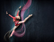 Photo: Young woman in gymnast suit posing Young woman in gymnast suit posing