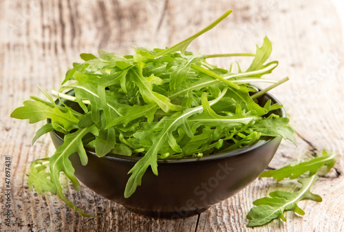 Photo: Rucola in black bowl Rucola in black bowl