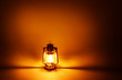 Photo: Kerosene lamp illuminated, concept gold lighting Kerosene lamp illuminated, concept gold lighting