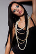 Passionate Young Female Body in Black Lingerie with Beads