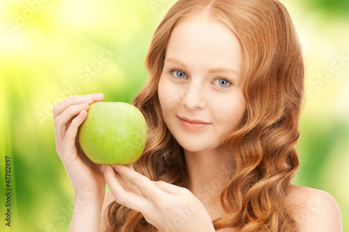 Photo: young beautiful woman with green apple young beautiful woman with green apple