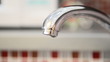 Water drops from a faucet