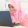 Asian teenager using notebook