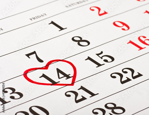 Photo: date of February 14 Valentine's Day red heart encircled date of February 14 Valentine's Day red heart encircled