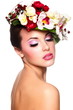 beautiful woman with bright makeup with colorful flowers on head