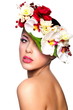 beautiful woman with bright makeup with colorful flowers on head