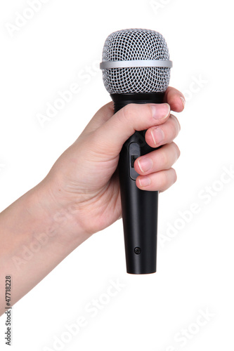 Photo: Black microphone in hand isolated on white Black microphone in hand isolated on white
