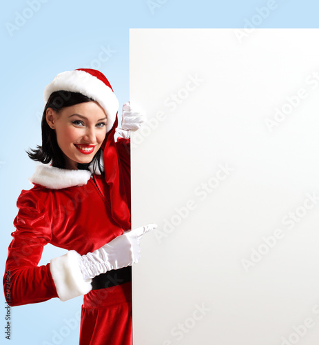 Photo: santa girl with a blank banner santa girl with a blank banner