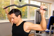 Handsome man working out in a gym