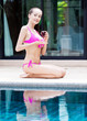 woman by the swimming pool