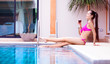 woman by the swimming pool