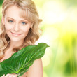 woman with green leaf