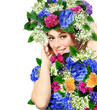 portrait of a young woman wearing a crown of flowers