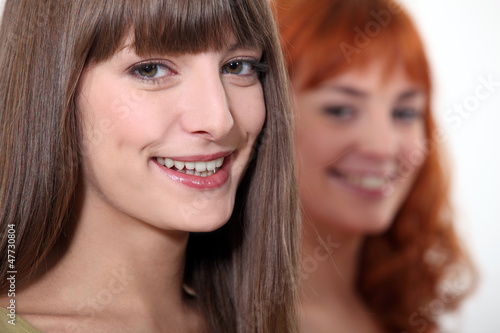Photo: two young women posing two young women posing