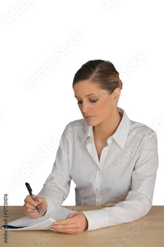 Photo: Employee filling in document Employee filling in document