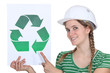 Craftswoman displaying recycling sign