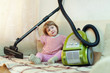 2 years girl with vacuum cleaner