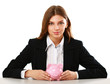Young beautiful woman sitting with piggy bank