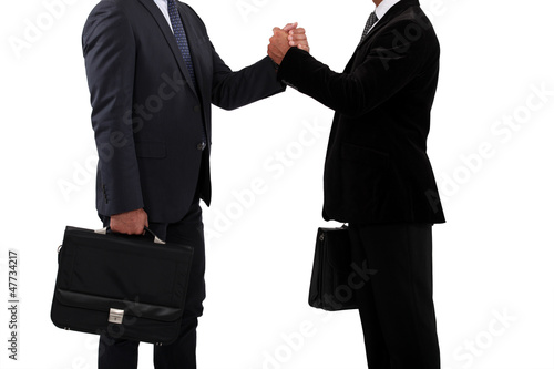 Photo: Business partners handshaking Business partners handshaking