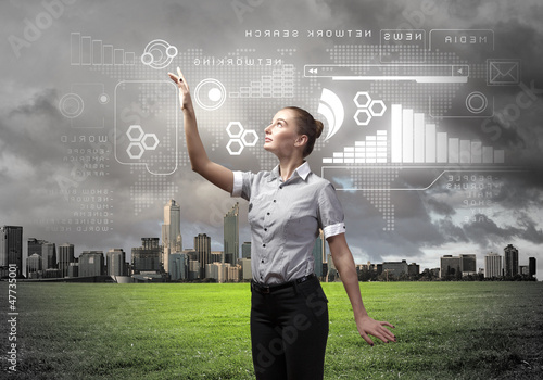 Photo: Businesswoman agaisnt virtual background Businesswoman agaisnt virtual background