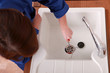 Plumber fixing a sink
