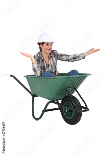 Photo: Woman sat in wheelbarrow Woman sat in wheelbarrow