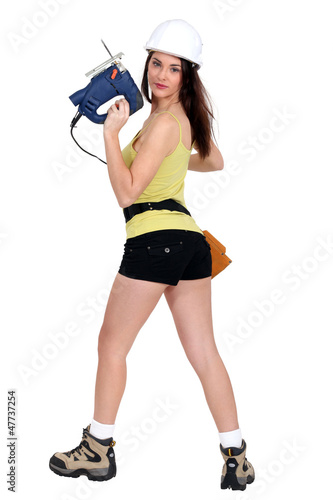 Photo: sexy woman holding a drill sexy woman holding a drill