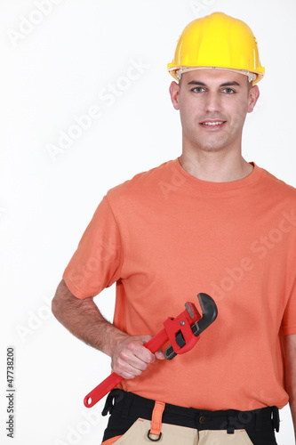 Photo: A maintenance guy with a wrench. A maintenance guy with a wrench.