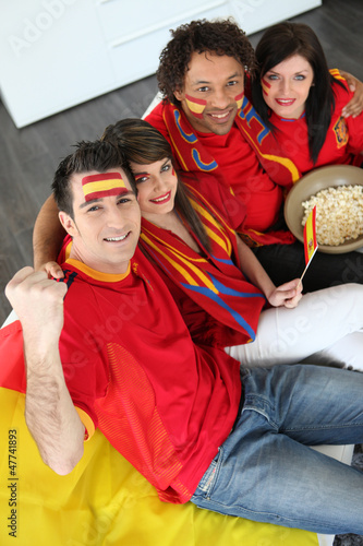 Photo: Four Spanish soccer fans waiting for the match to start Four Spanish soccer fans waiting for the match to start