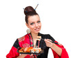 Woman wearing a traditional red dress eating sushi