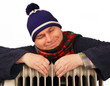 man basking in the heater.