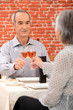Couple toasting with rose wine