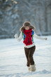 Foto: Young woman in a snowy furry hood Young woman in a snowy furry hood