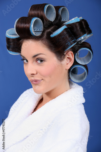 Photo: woman in bath robe and curlers in her hair woman in bath robe and curlers in her hair
