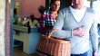 Young couple after shopping getting out of supermarket, steadica