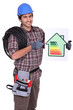 Tradesman pointing to an energy efficiency rating chart