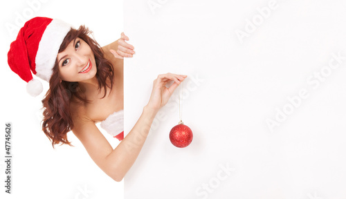 Photo: Santa woman decorating a white blank board Santa woman decorating a white blank board